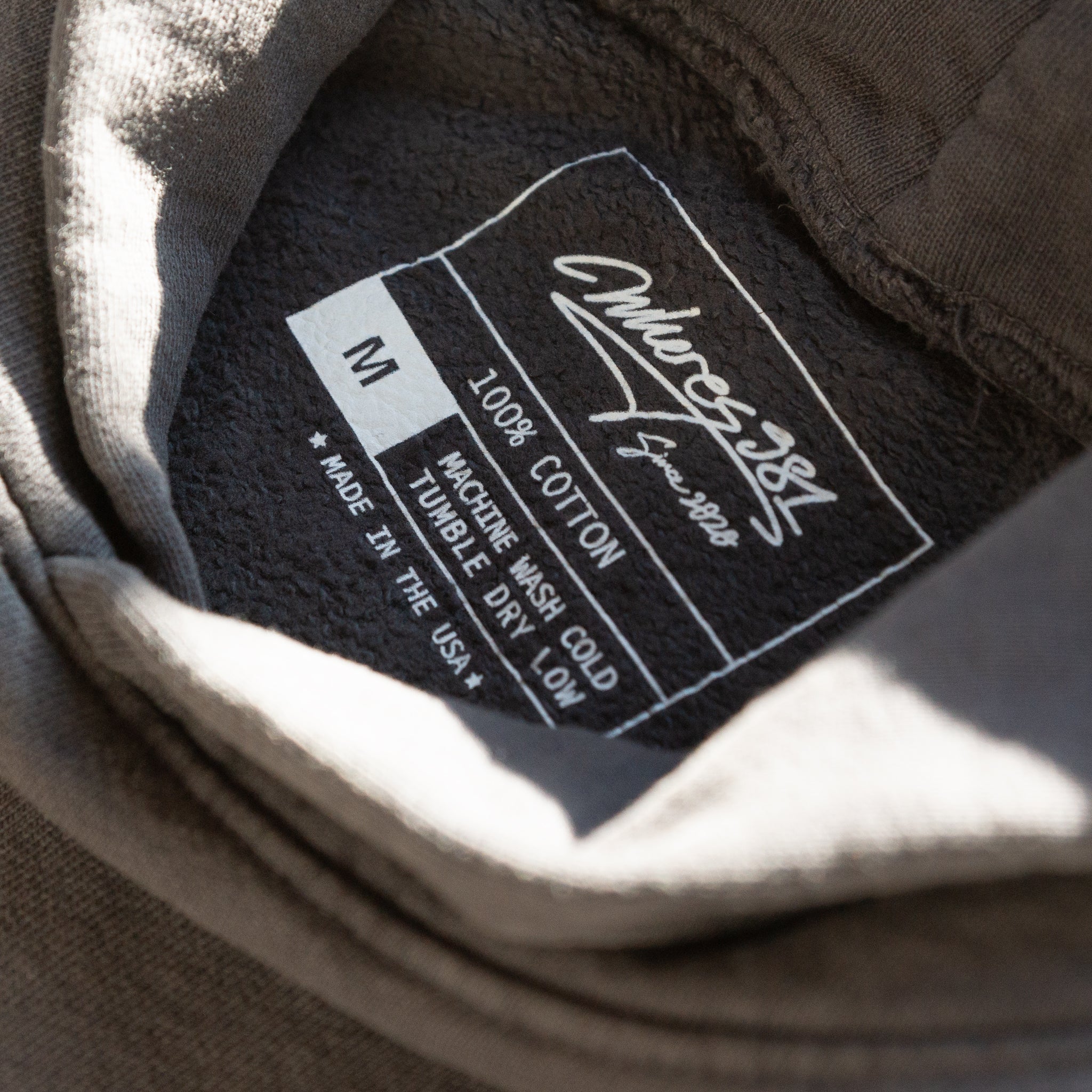 swim> dark grey hoodie